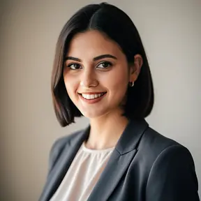 Professional portrait of a young French female entrepreneur, natural light, soft neutral background, friendly and confident smile, modern business casual outfit, realistic headshot photography
